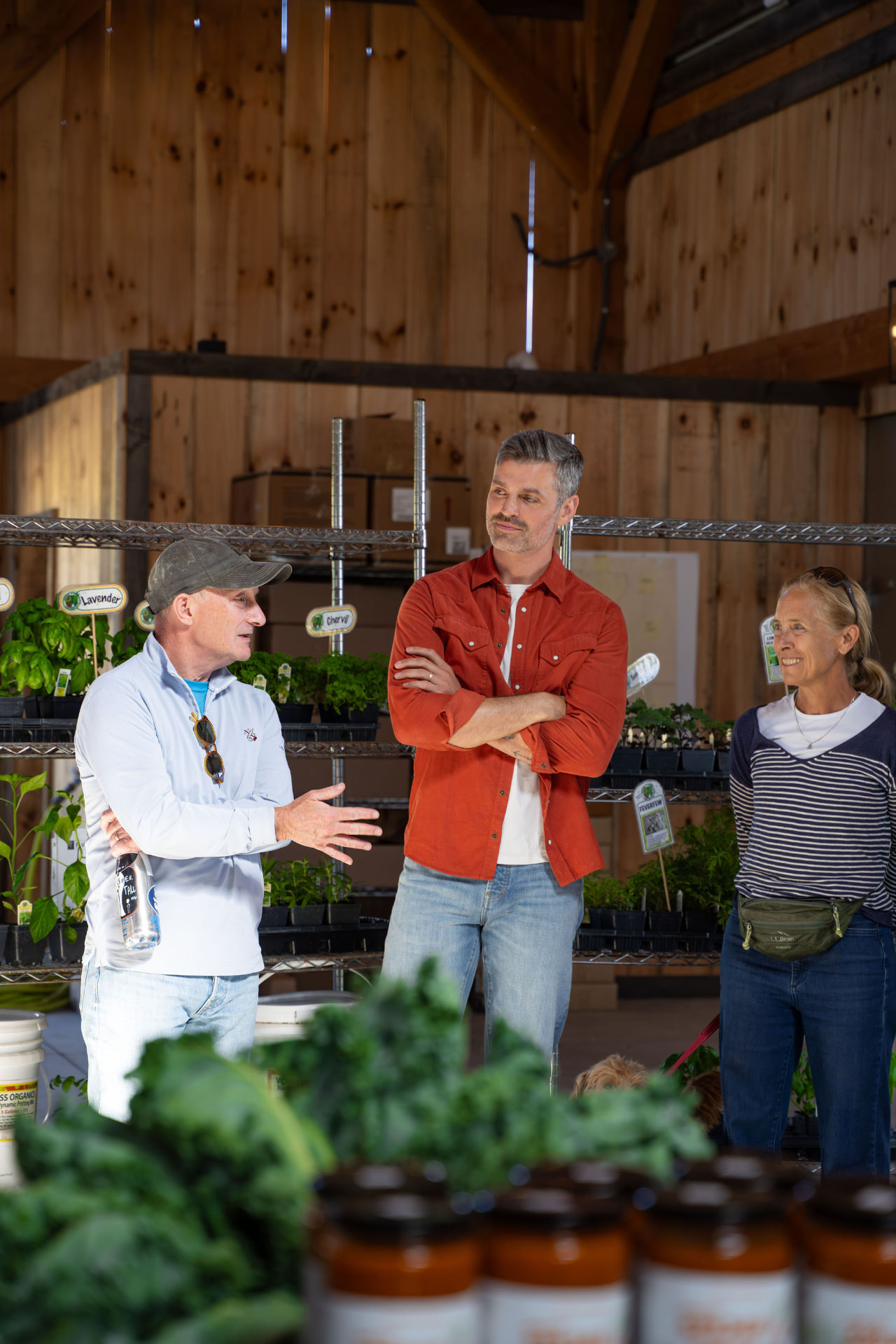 Retreat guests looking at herbs and seedlings in the farm shop at Flynn Creek Farm