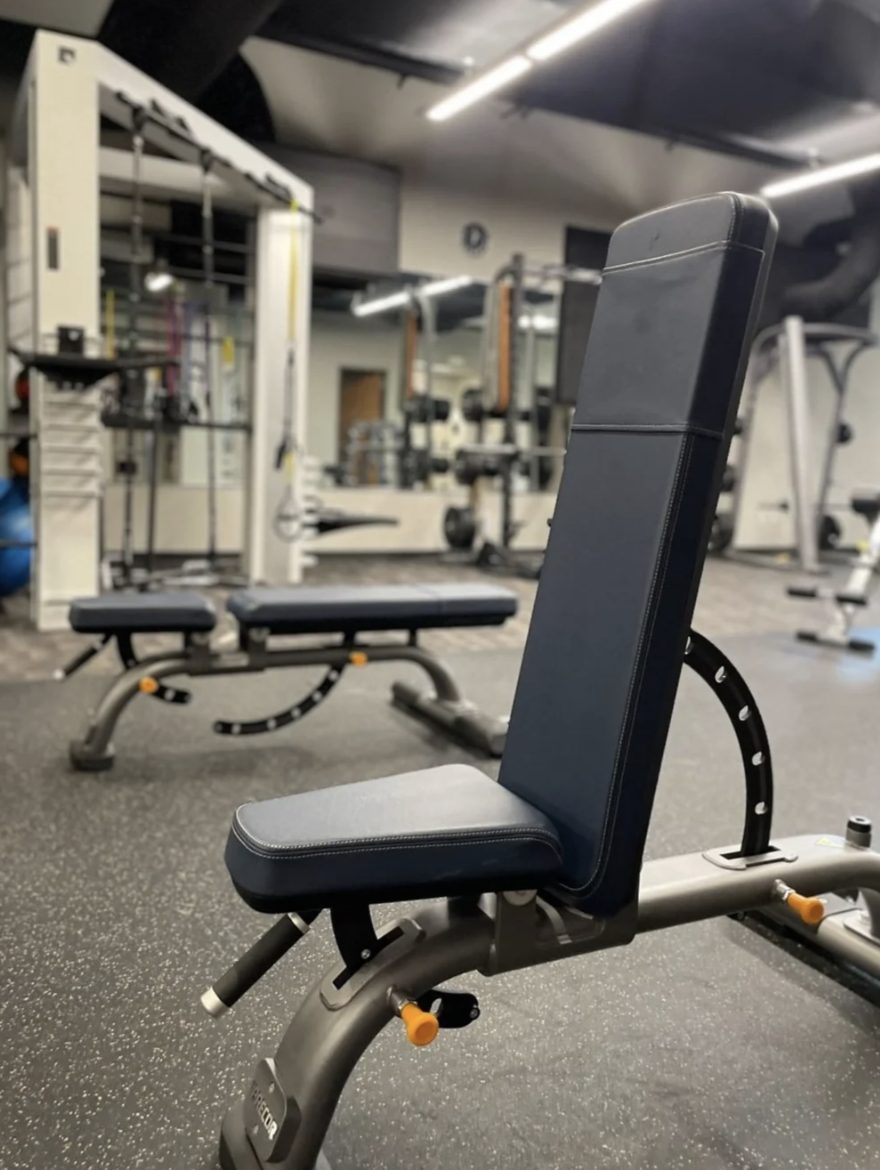 An inclined adjustable bench on the PKFit Madison East training floor