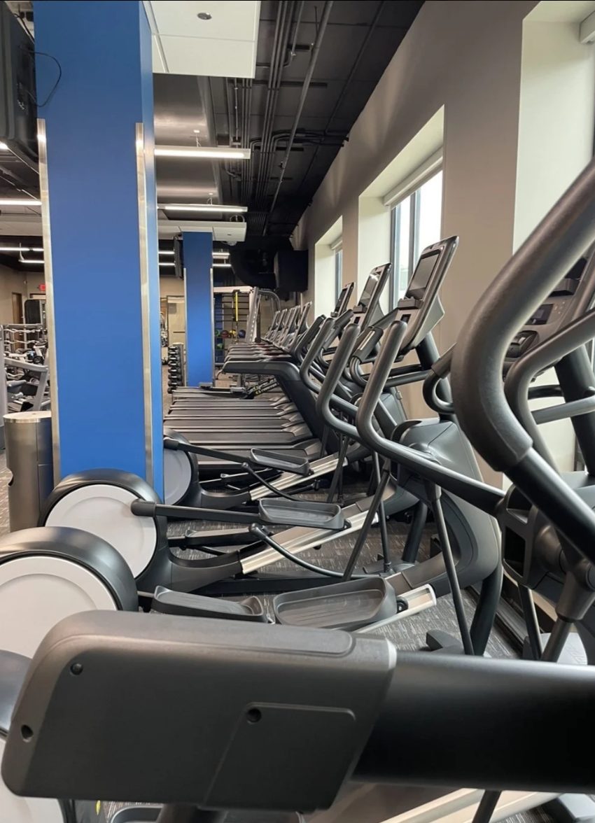 Ellipticals and treadmills along the windows at PKFit Madison East
