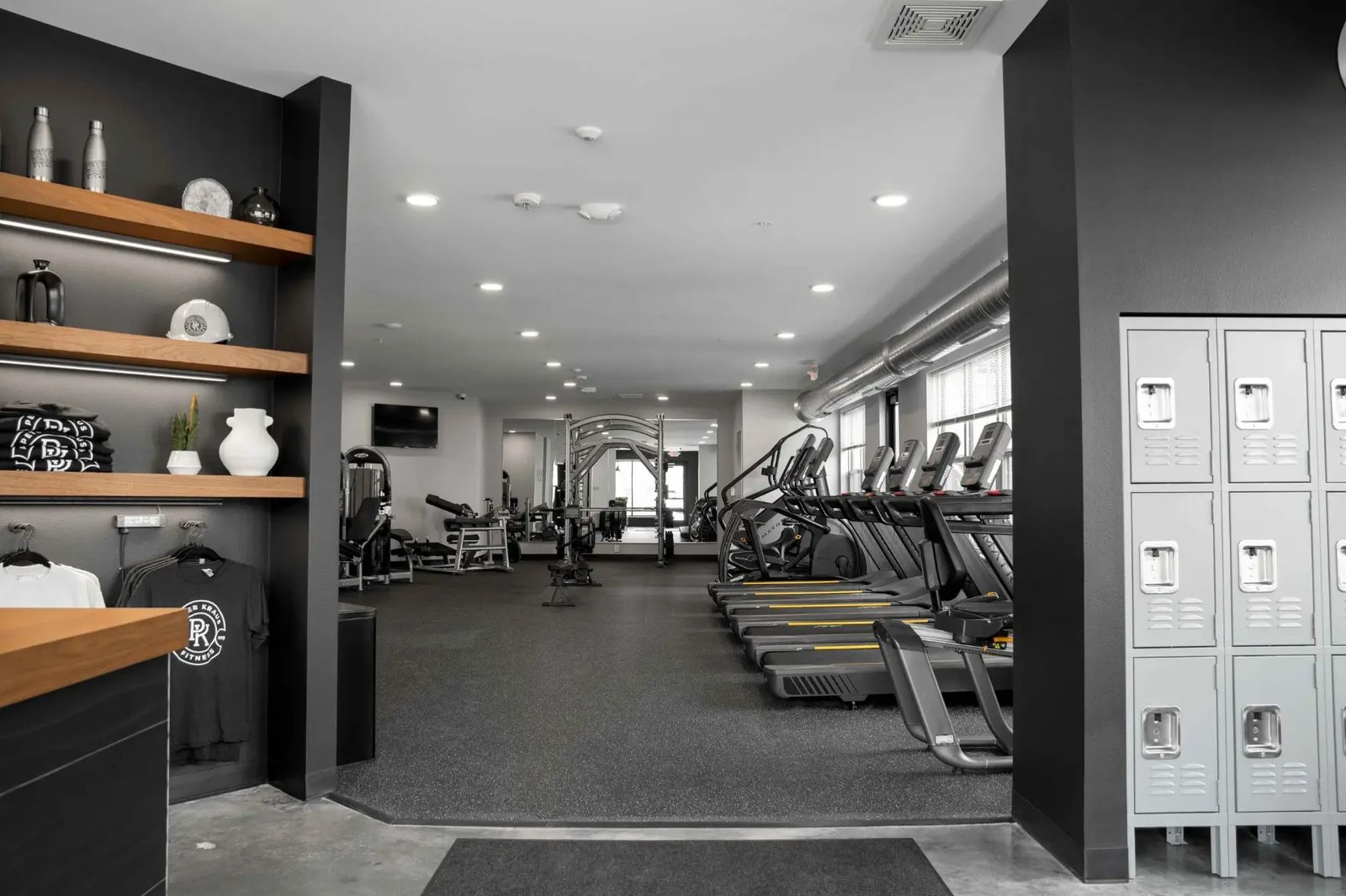 The PKFit Verona entryway with branded merchandise, water bottles, and lockers